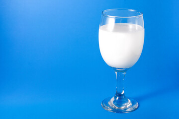 Photo of milk in a wine glass.