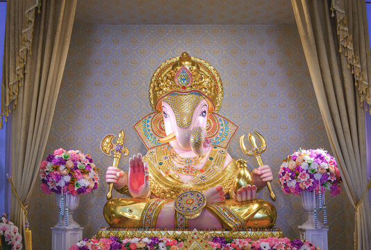 Beautiful Lord Ganesha Dagadusheth statue enshrined in a Hindu temple