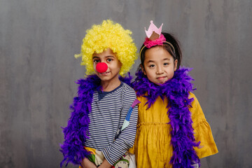 Portrait of children in funny costumes, studio shoot.