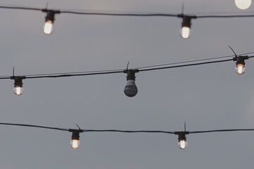 Street lighting. Electric light bulbs. External illumination. A bulb that burned out. Not like...