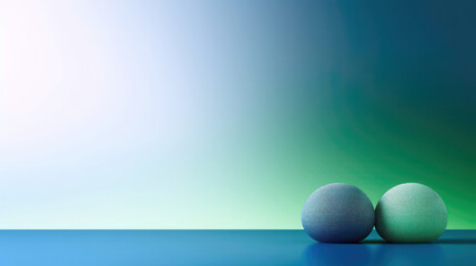 two small pebbles on a blue and green background with space for text 