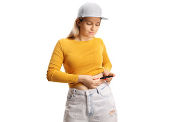 Young female injecting insulin shot in the belly