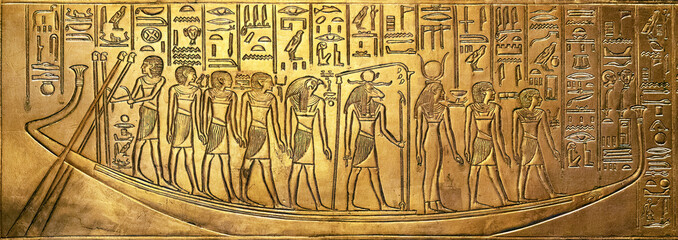 Bas relief with egyptian gods on a boat from Tutankhamun tomb