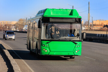 Fototapeta premium Bus moves along the city street