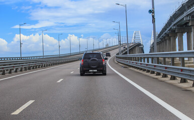 Cars moving towards the arches of the Crimean bridge