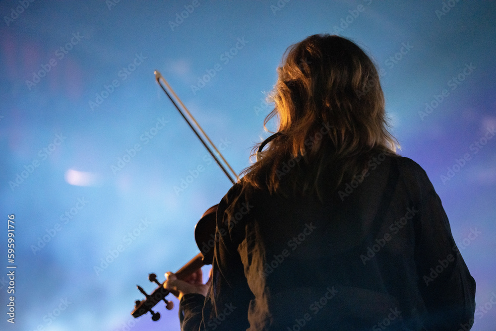 Wall mural band playing music and a gig in a venue, close up of a rock band playing guitars and instruments.