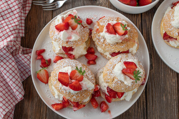 Strawberry shortcake on wooden table