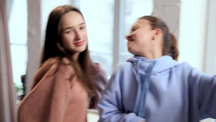 Blogging. Two teen girls recording videos with mobile phone at home, making social media publications. Online popularity. Concept of mass media, blogging, modern technologies, influence