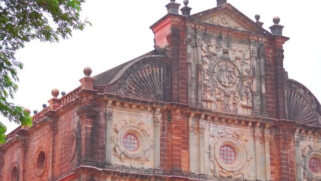 Closeup shot of writings on the top of the Basilica of Bom Jesus monument in Goa, India. Ancient church built by Portuguese at Panaji in North Goa. UNESCO world heritage site of Goa.