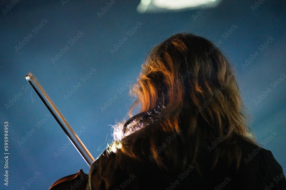 Wall mural band playing music and a gig in a venue, close up of a rock band playing guitars and instruments.