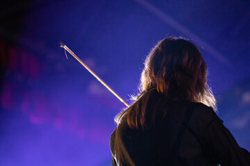 Band playing music and a gig in a venue, close up of a rock band playing guitars and instruments.
