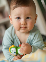 Portrait of cute baby boy looking at camera. Joy and happiness concept. Love and family emotion