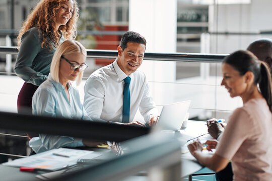 Diverse businesspeople working together around a table