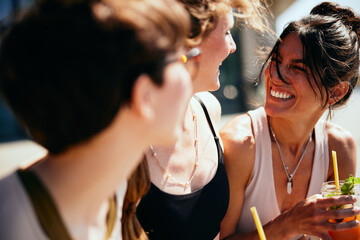 Friends laughing over juice after yoga