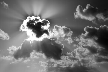 Cloud formations on sunny evening sky in Martinique France with shades grey. Sun hidden behind a...