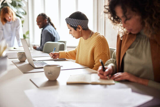Focused businesspeople working at an office table