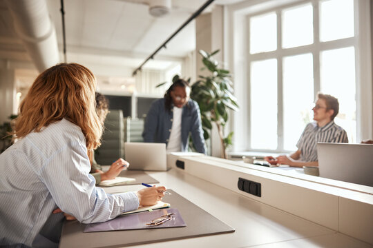 Diverse businesspeople meeting around a table