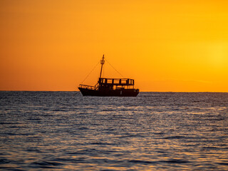 Sunset, sea, ships and boats