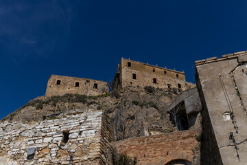 Craco, Basilicata. Abandoned city. A ghost town built on a hill and abandoned due to geological problems. Surreal look, horror film scenery. Panorama of the Calanchi Park.