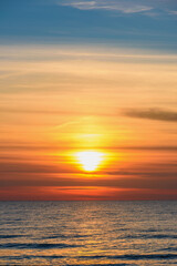 Naklejka na ściany i meble Spectacular bright golden sunset over Baltic sea