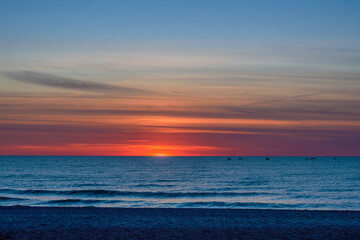 Obraz premium Spectacular bright golden sunset over Baltic sea