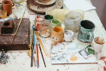 Set of art supplies on table in workshop