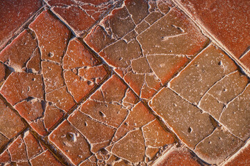 Old stone tiles on the floor of the castle, cracked terracotta tiles, idea for a background or...