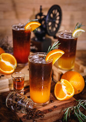 Glass of iced americano black coffee and layer of  fruit  orange