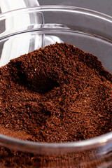 Ground coffee in a glass jar on the table