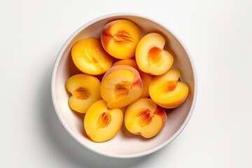 Fresh peach slices, pieces in a white bowl. Ingredients for juice, salad, dishes, cuisine.