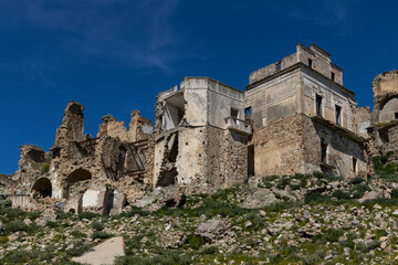 Craco, Basilicata. Abandoned city. A ghost town built on a hill and abandoned due to geological problems. Surreal look, horror film scenery. Panorama of the Calanchi Park.