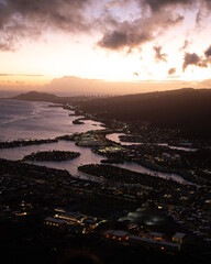 Sunset from top of Koko Head Crater. High quality photo. A railroad track hike up a mountain on Oahu, Hawaii.