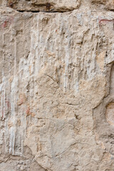 concrete stone wall with streaks of cement