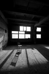 Black and white photo of abandoned building interior.