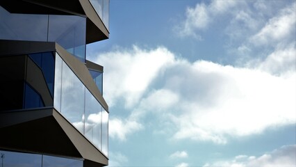 building with glass facade against cloudy sky