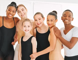 Wall murals Dance School Friends forever in life and ballet. a group of young ballet dancers having fun in a dance studio.