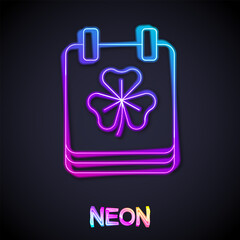 Glowing neon line Saint Patricks day with calendar icon isolated on black background. Date 17 March. Vector