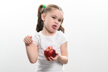 Red apple and little girl, portrait of a child on a white background