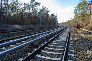 Fototapeta na wymiar Surface Level Of Railroad Tracks Against Sky