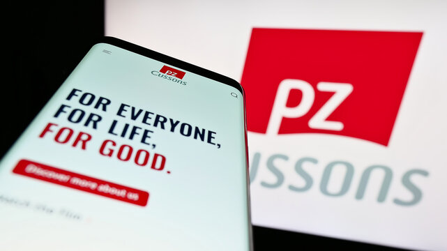 Stuttgart, Germany - 04-20-2023: Mobile phone with website of British consumer goods company PZ Cussons plc on screen in front of logo. Focus on top-left of phone display.