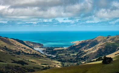Naklejka premium Akaroa on Banks Peninsula in the Canterbury Region of the South Island of New Zealand. The area was also named Port Louis-Philippe by French settlers after the reigning French king Louis Philippe I