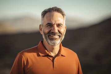 Fototapeta premium Pet portrait photography of a cheerful man in his 50s wearing a sporty polo shirt against a mountain landscape background. Generative AI