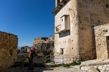 Craco, Basilicata. Abandoned city. A ghost town built on a hill and abandoned due to geological problems. Surreal look, horror film scenery. Panorama of the Calanchi Park.