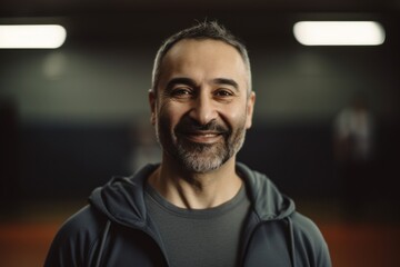 Obraz premium Portrait of a smiling middle-aged man in a gym.