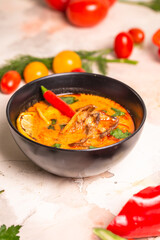 asian spicy tom yam soup with hot pepper and seafood