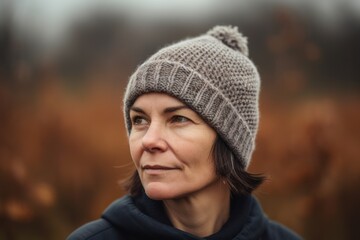 Portrait of a middle-aged woman in a knitted hat.
