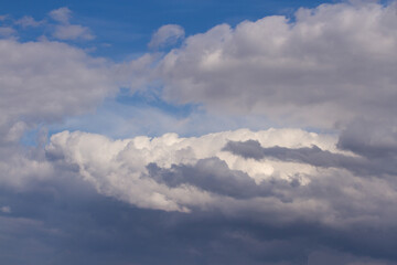 The beginning of a thunderstorm in the blue sky, background, texture.