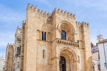 Fototapeta na wymiar Coimbra, Portugal: Facade of the Old Cathedral of Coimbra; medieval church in the center of the old town