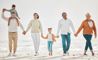 Find time for family. Full length shot of an affectionate family of six on the beach.