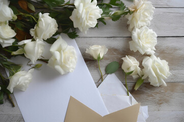 White roses with kraft envelope. Generative ai